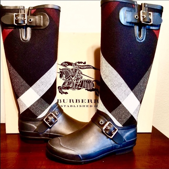 Burberry Shoes - Bundle list. Burberry Boots, AG Jeans and Wristlet